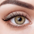Aura Lens colored contact lenses in Radiance Brown – luminous, golden-brown lenses that brighten the eyes with a radiant, natural glow.